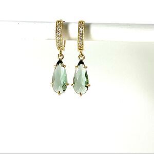 Gold huggie hoops for women with neutral green crystal charms